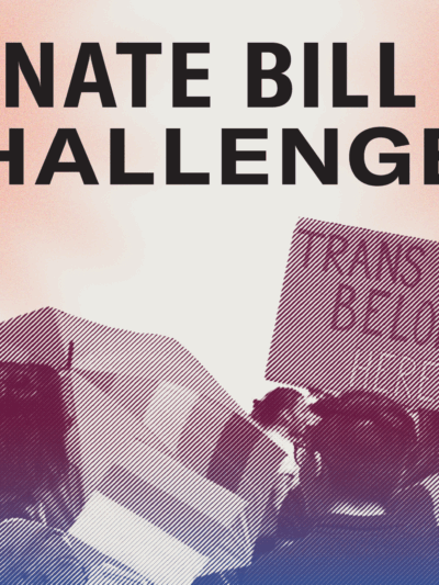 Large group of people protesting government attacks on transgender Missourians. One sign reading "Trans Kids Belong Here"