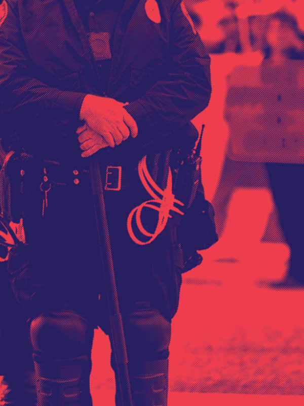 red and dark blue image, police officers standing by with a protester in the background
