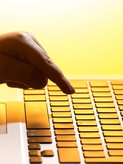 A finger pressign a keyboard.