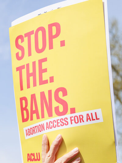 A protest sign that says Stop the Bans.