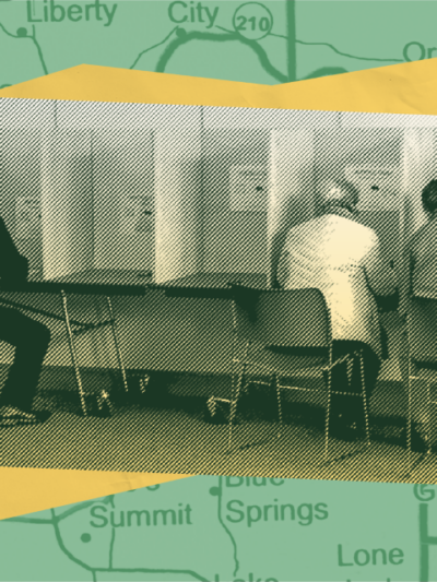 an image of people sitting at polling station